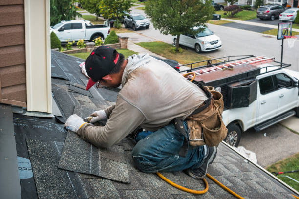 Professional Roofing technician working in Bohemia, NY